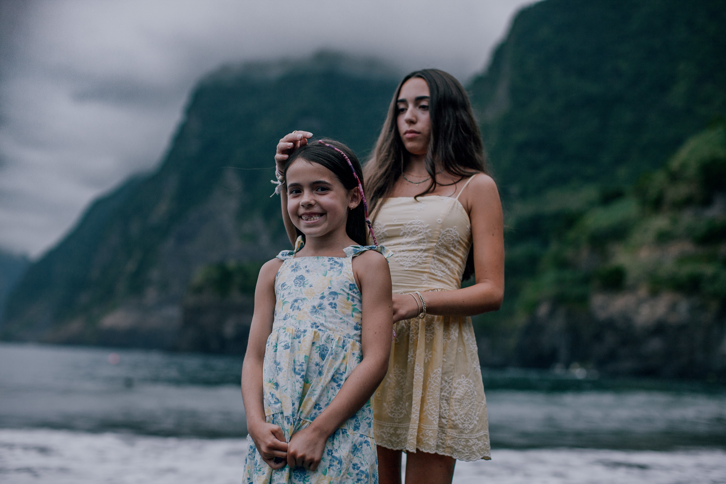 Portrait of both daughters on the dark shore, Seixal Beach, Madeira