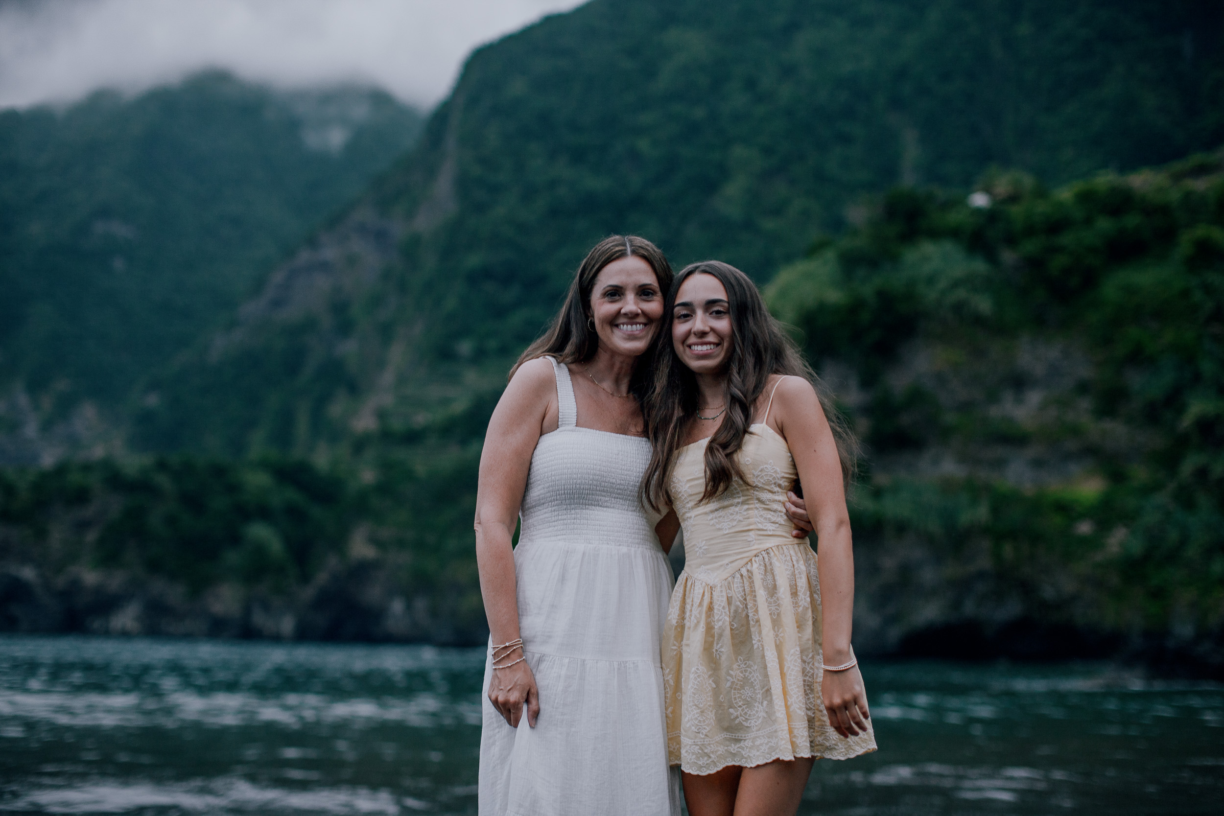 Mother and teenage daughter arm in arm, Seixal, Madeira