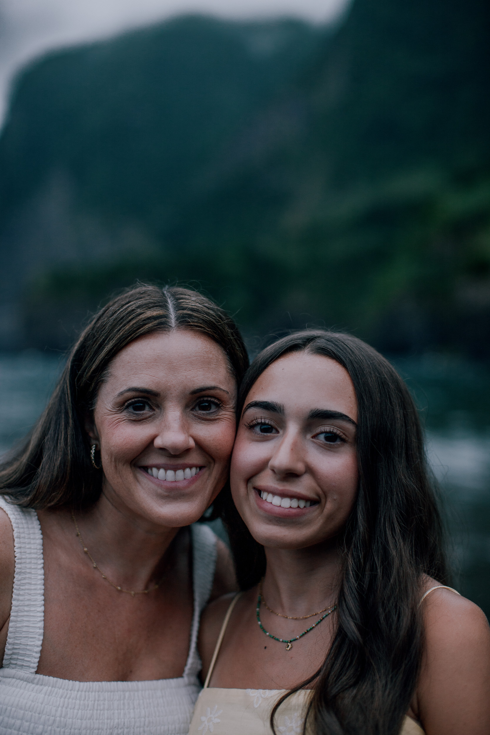 Mum and the teenage daughter cheek to cheek smiling, Seixal, Madeira
