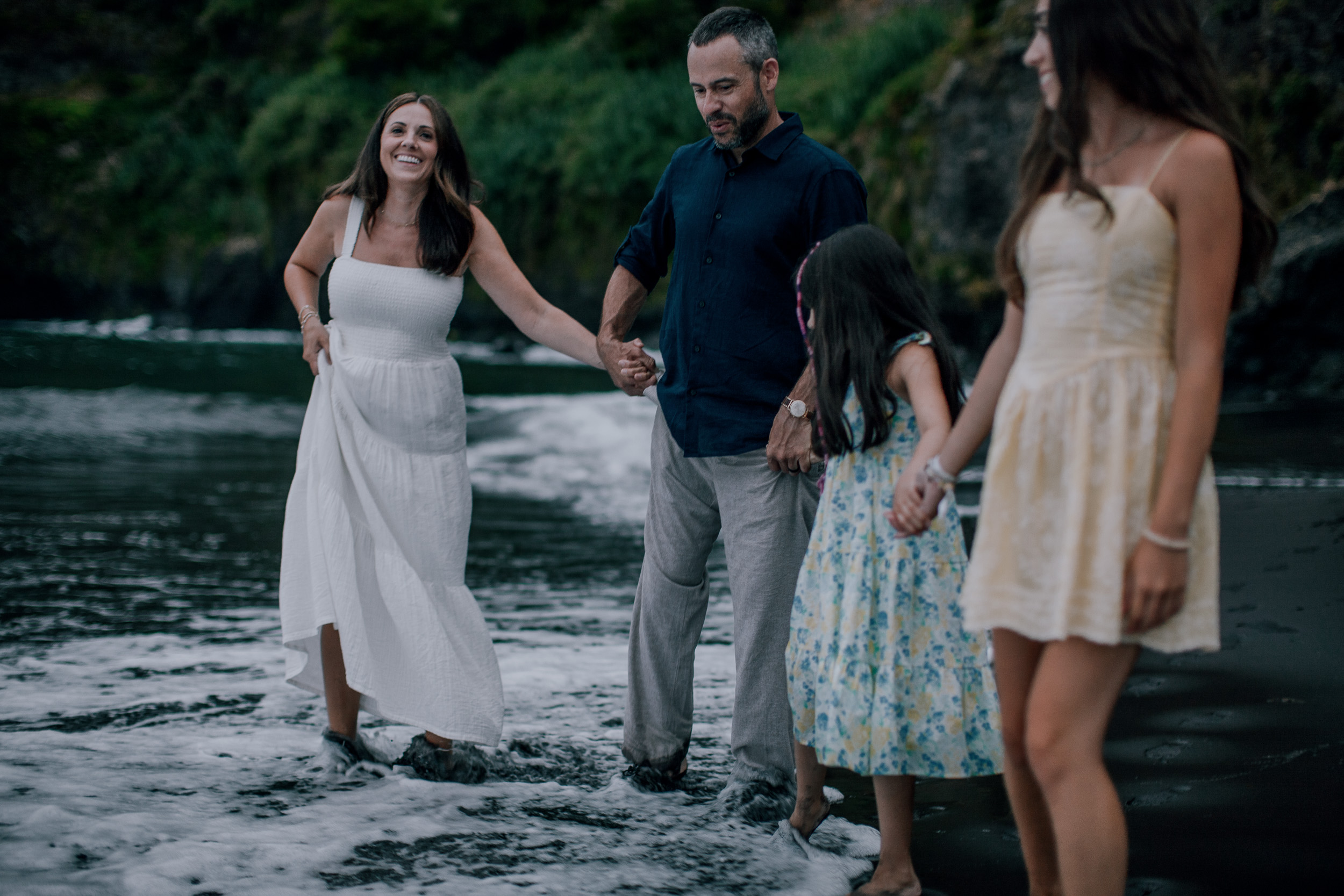 Wading together through the evening surf, Seixal Beach, Madeira