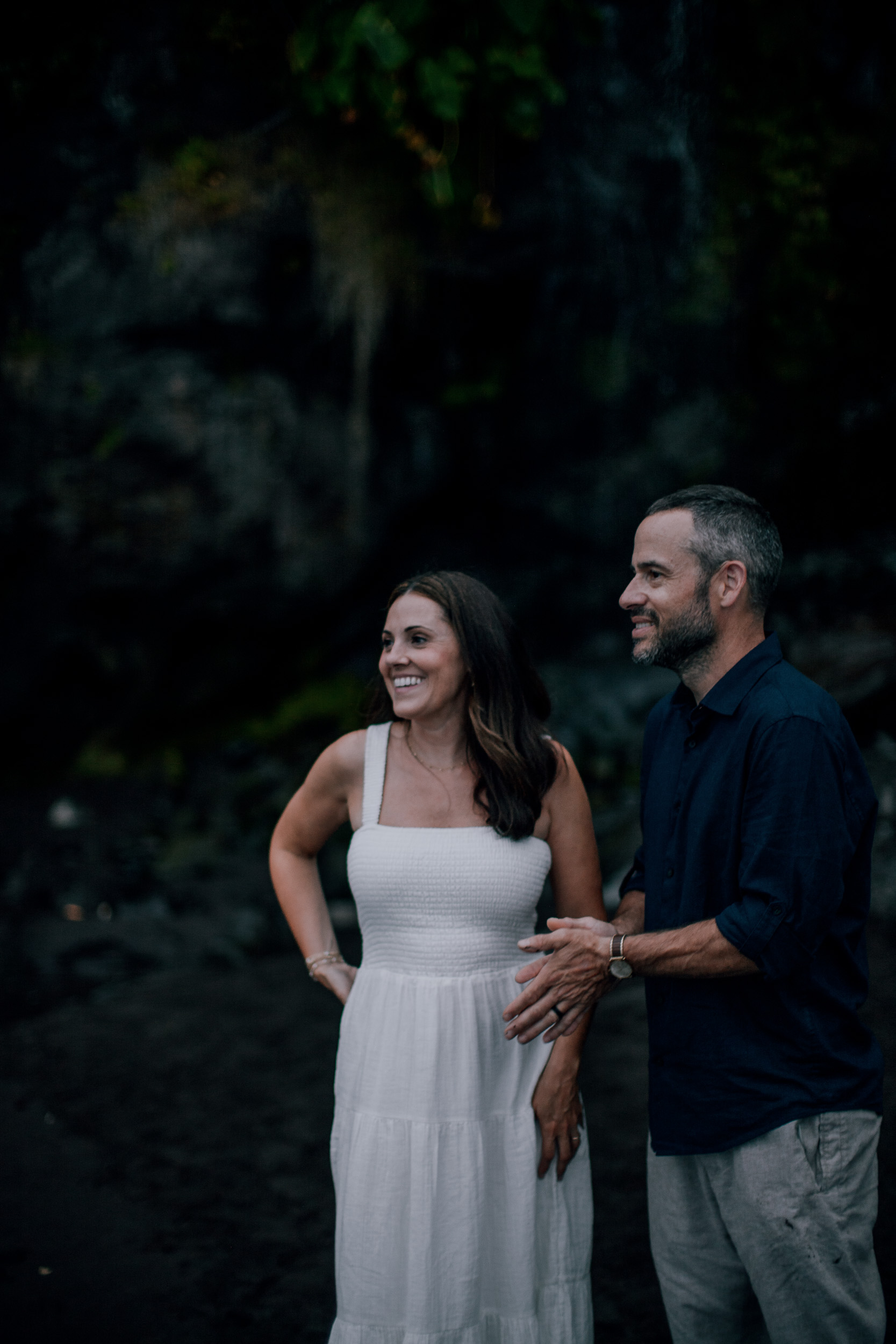 The parents laughing together on the black sand, Seixal, Madeira