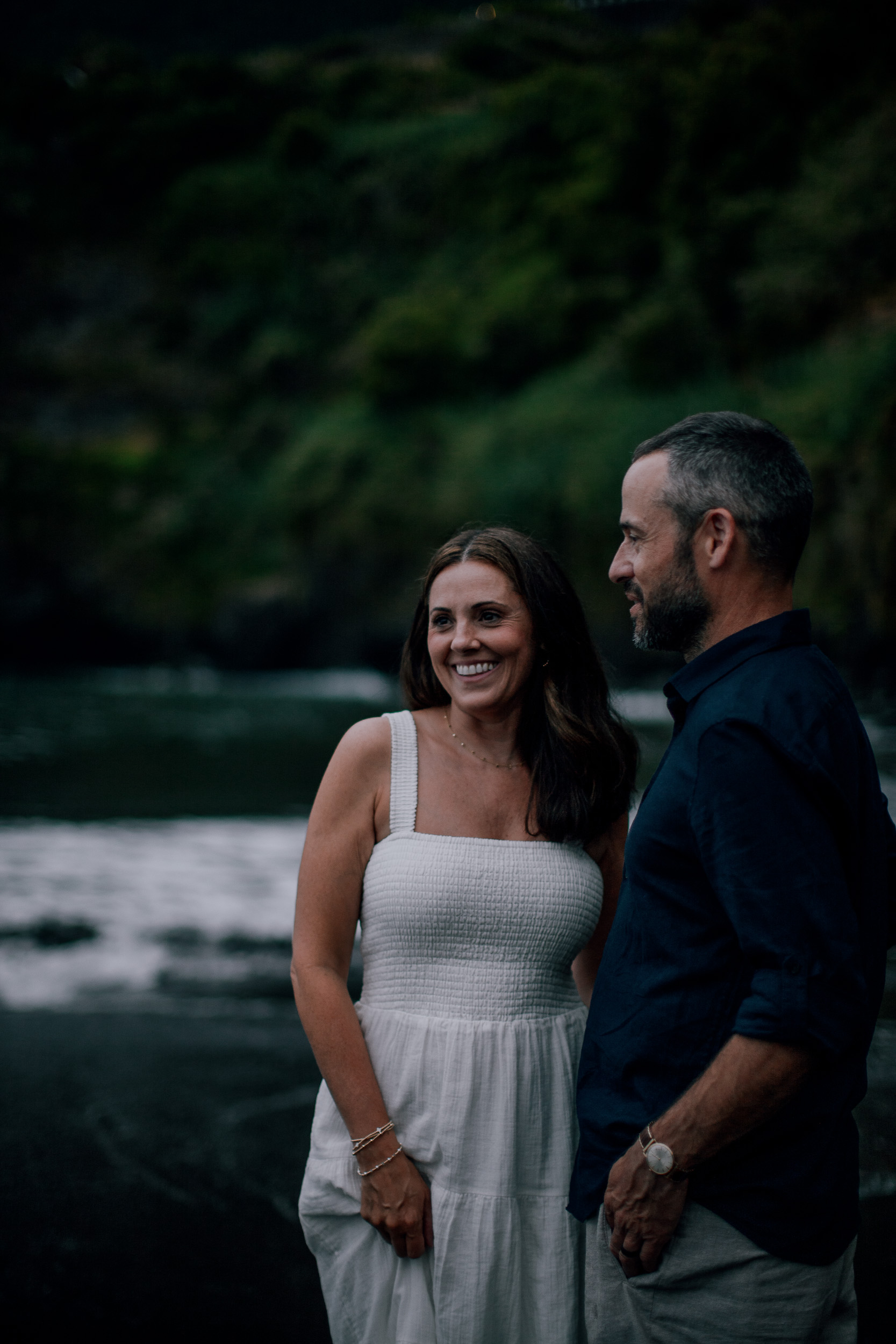 The parents holding hands in the low light, Seixal, Madeira