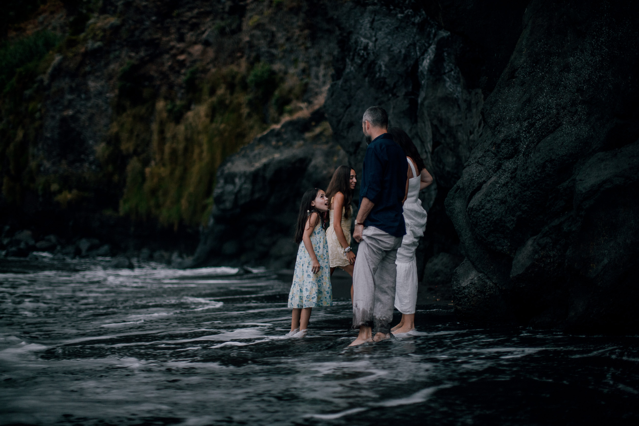 Four of them at the rock pools beneath the cliff, Seixal Beach, Madeira