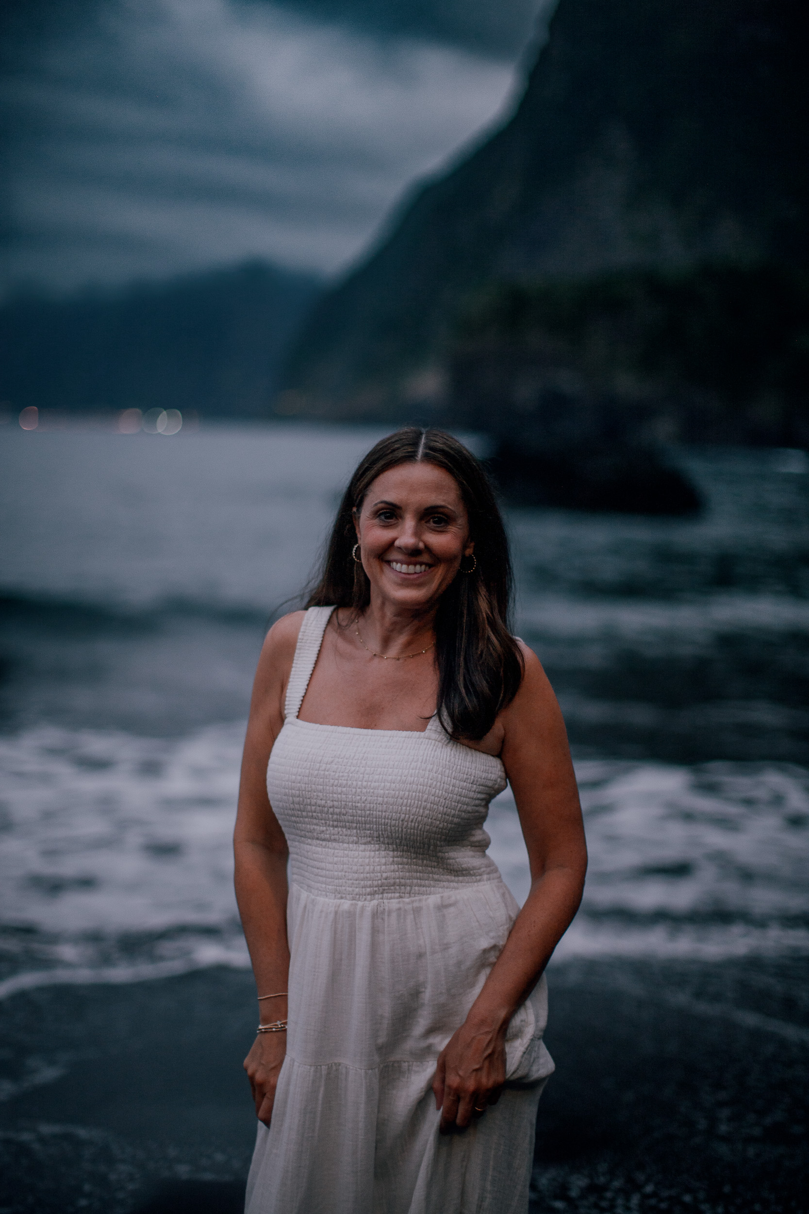 The mother at the waterline as night falls, Seixal Beach, Madeira