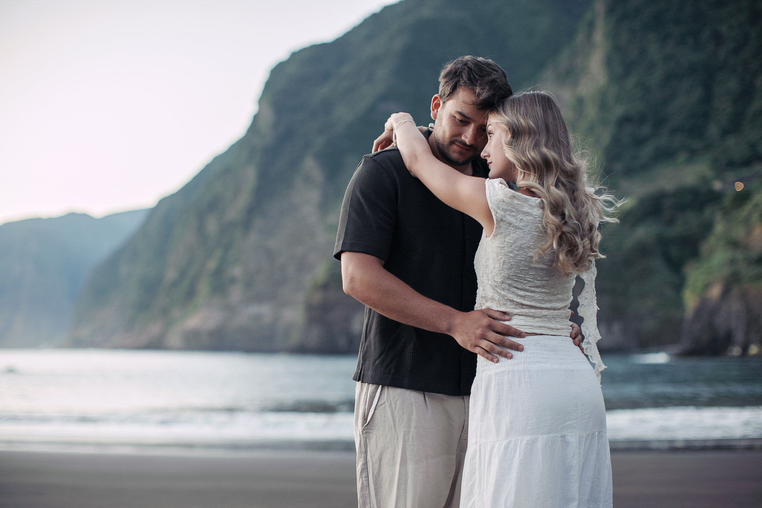 Holding each other at the foot of the cliffs, Seixal Beach, Madeira