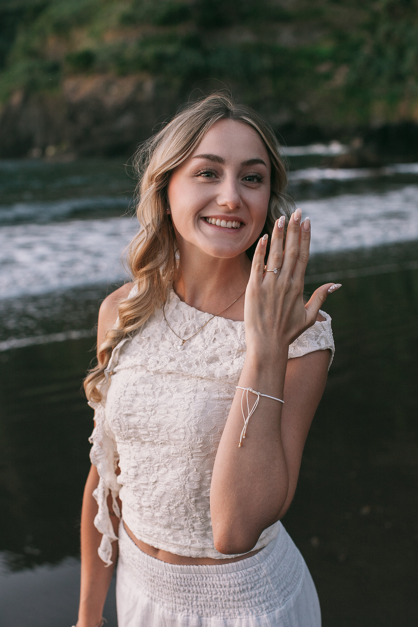 Laura showing her ring to the camera with a smile, Seixal Beach, Madeira