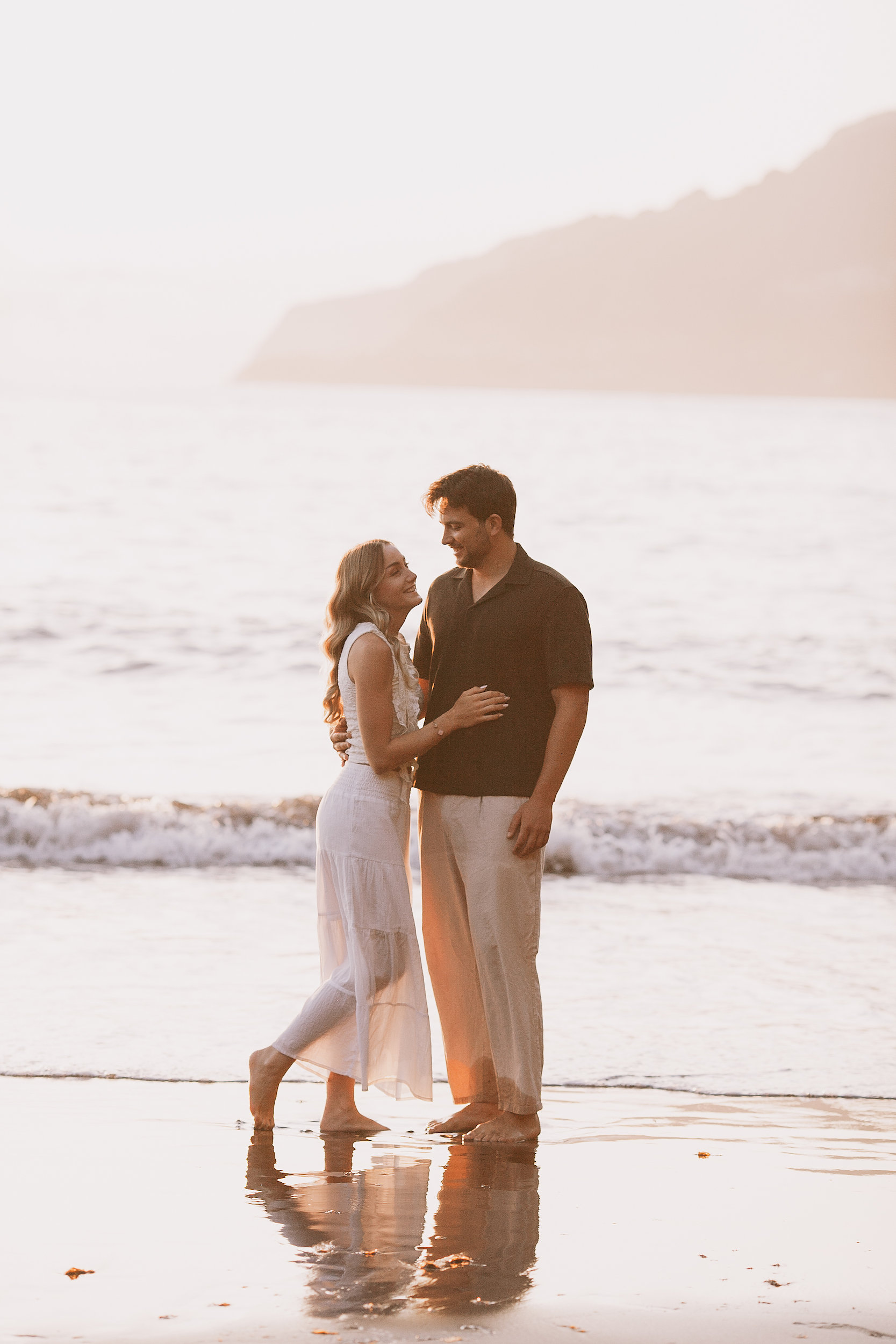 She looks up at him in the last warm light, Seixal, Madeira