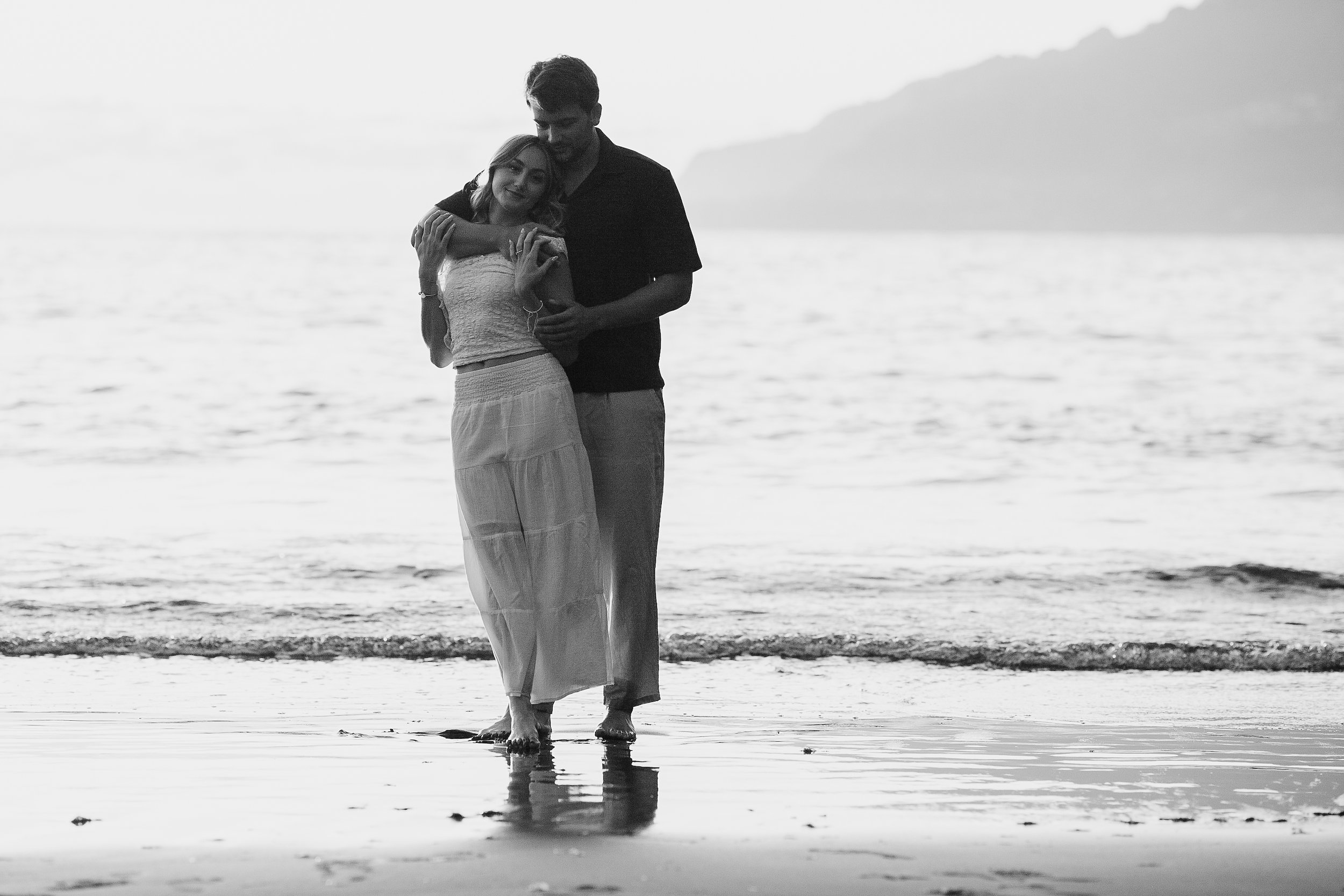 Black and white embrace at the shore, Seixal Beach, Madeira