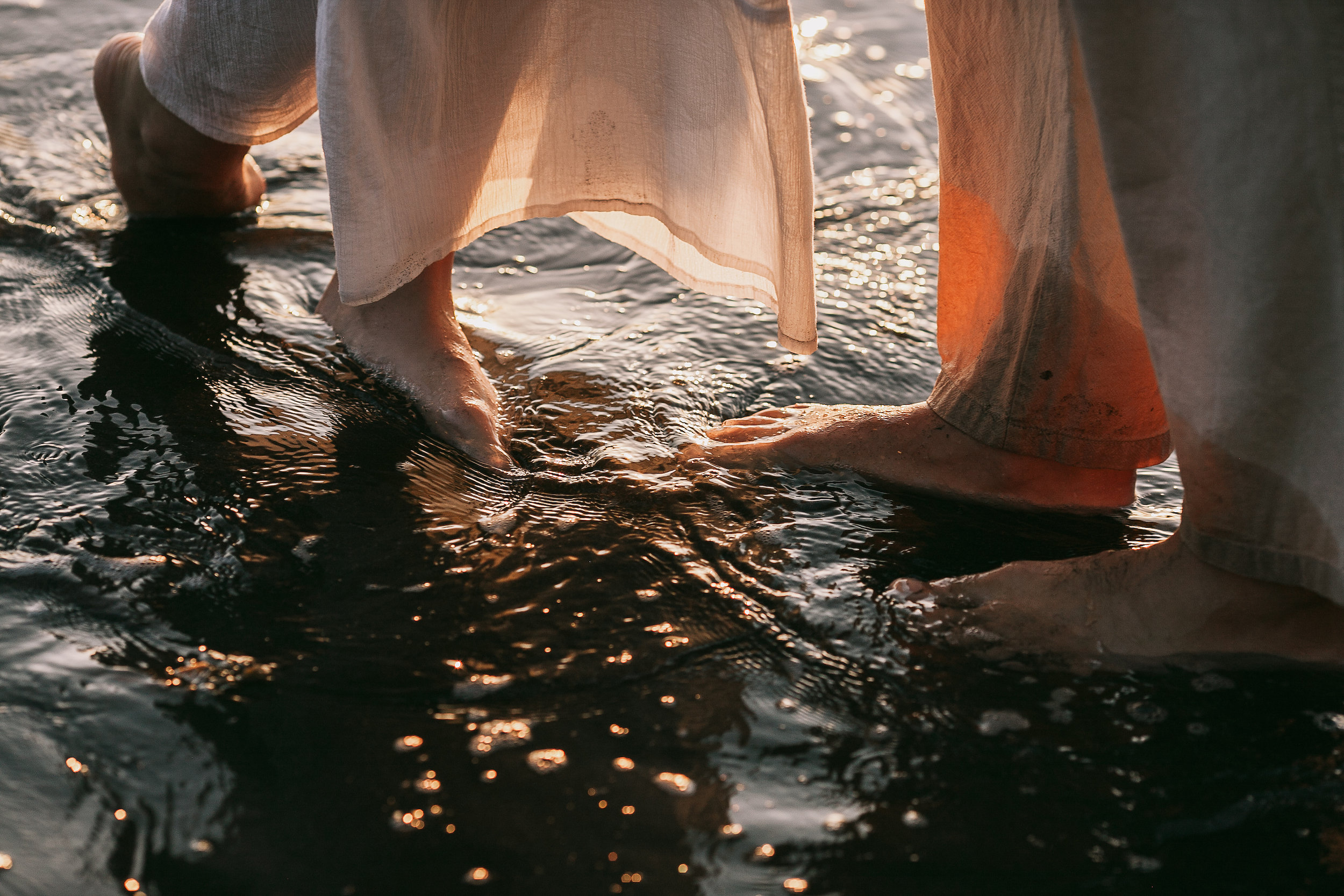 Their feet in the glittering shallows at sunset, Seixal, Madeira