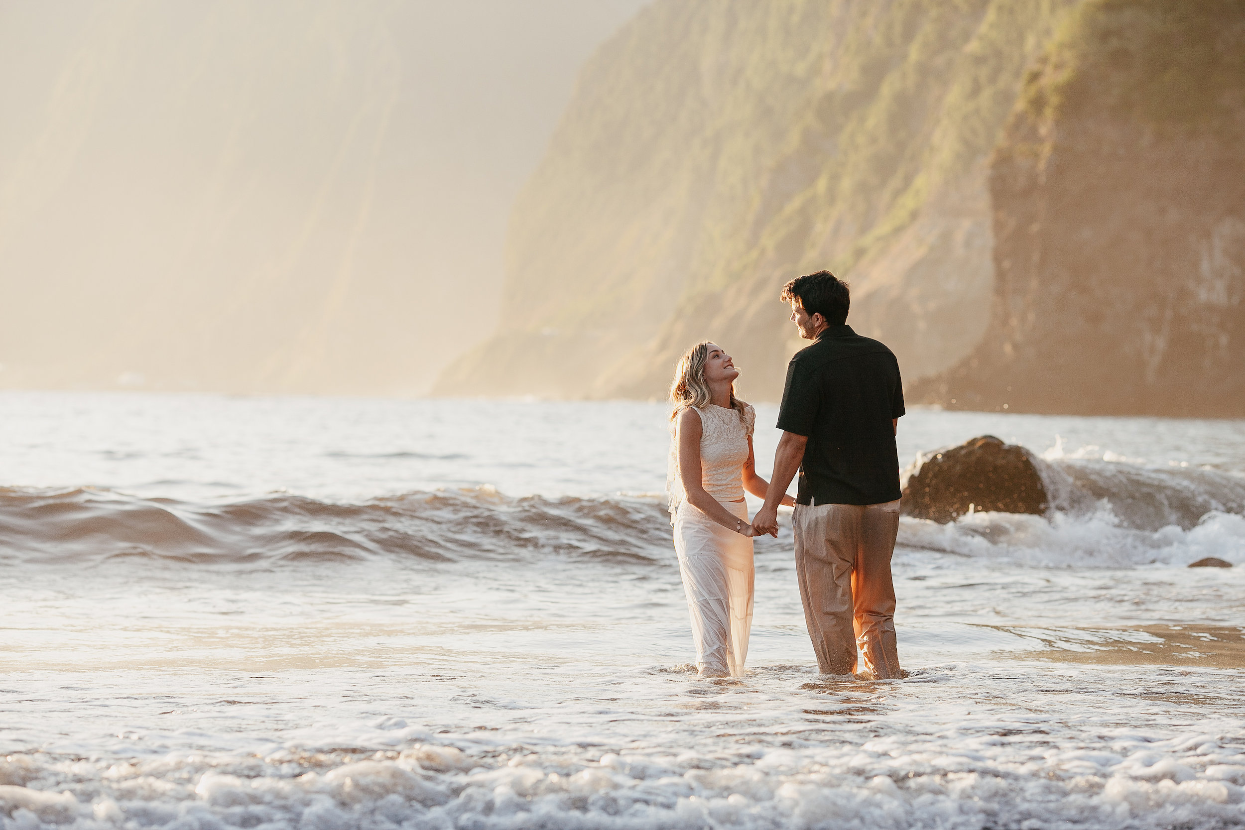 Holding hands in the surf, wet dress catching the light, Seixal, Madeira