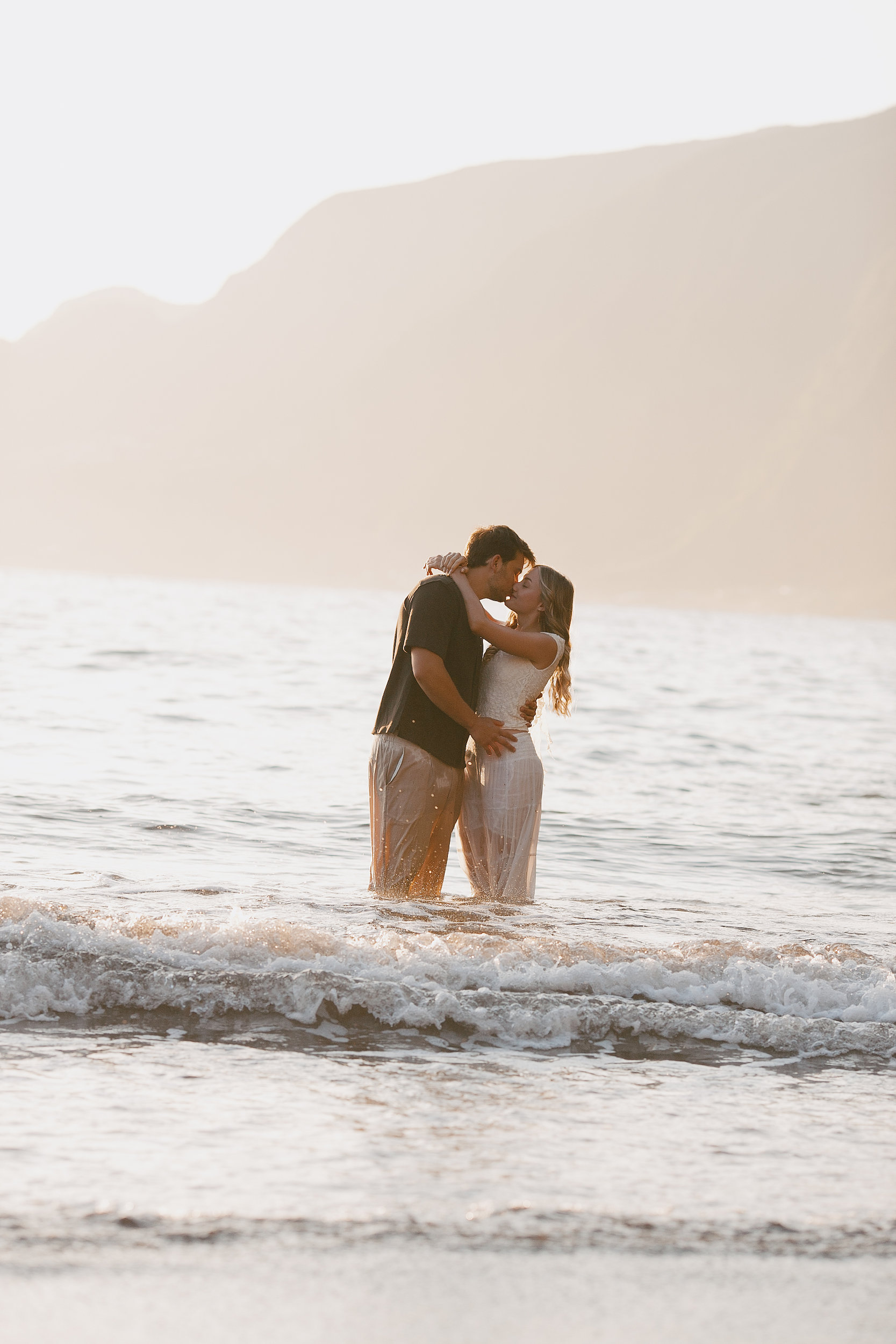 Wrapped together in the waves at last light, Seixal Beach, Madeira