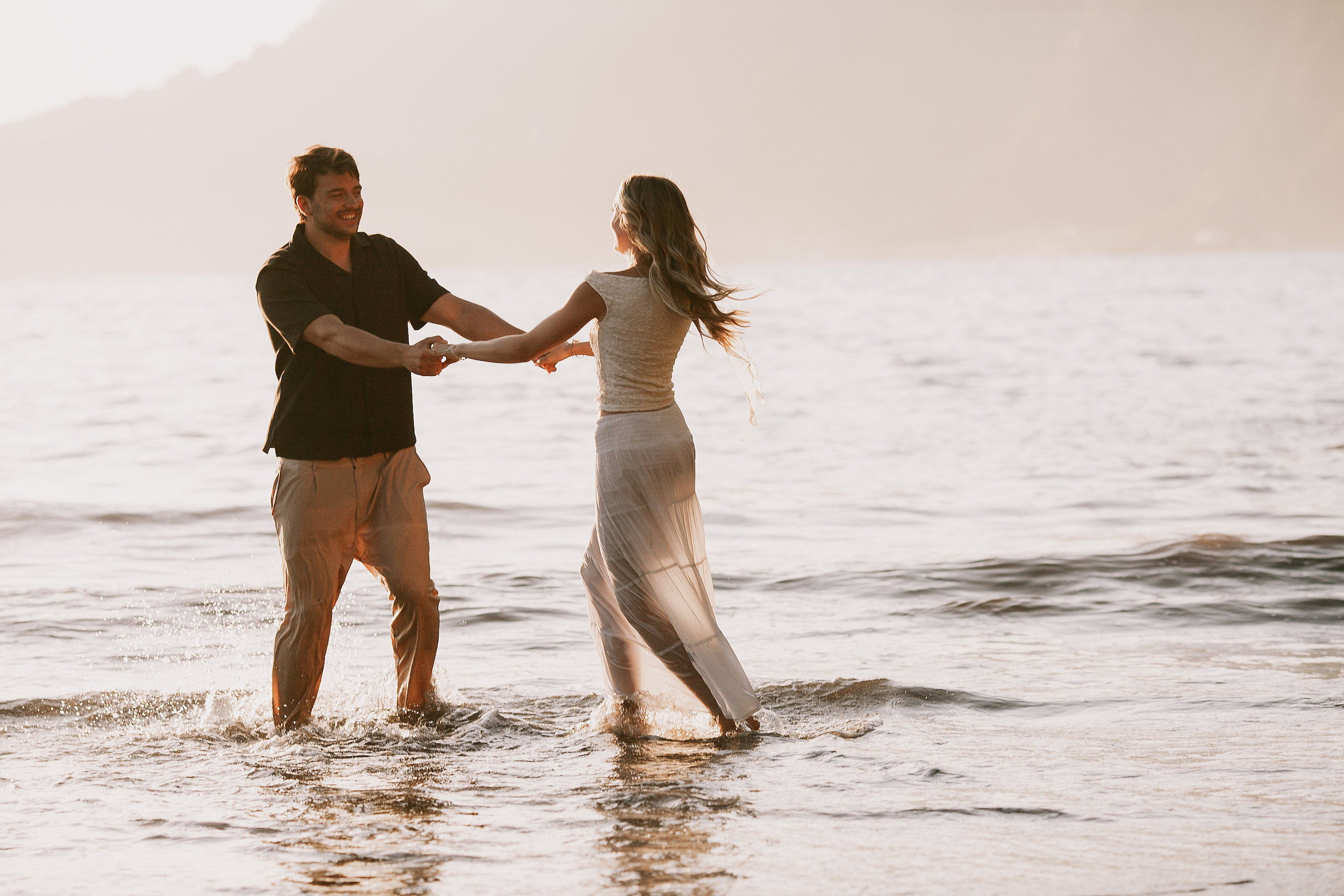 Spinning her by the hand in the shallows, Seixal Beach, Madeira