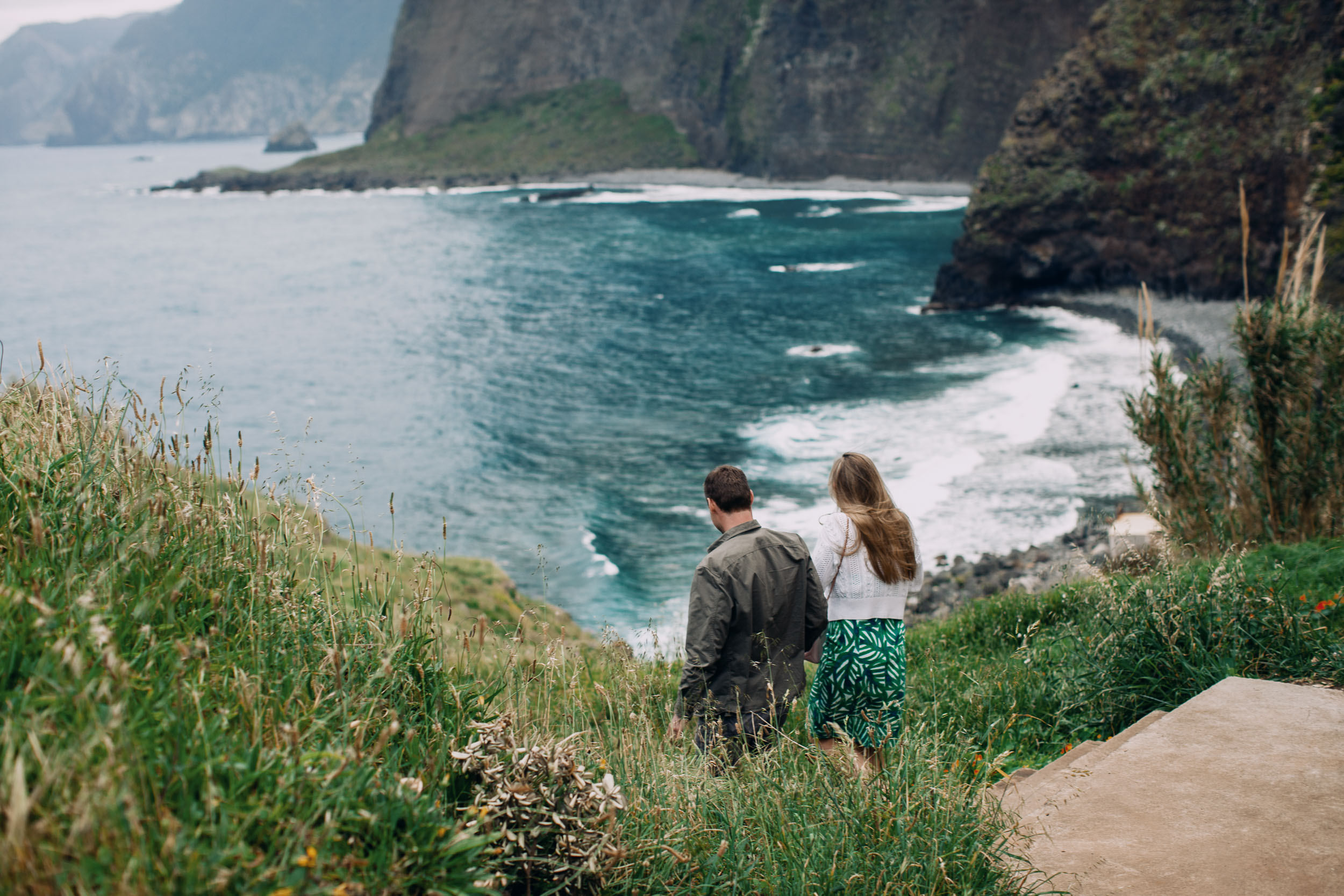 Couple embracing at rocky viewpoint, Funchal, Madeira