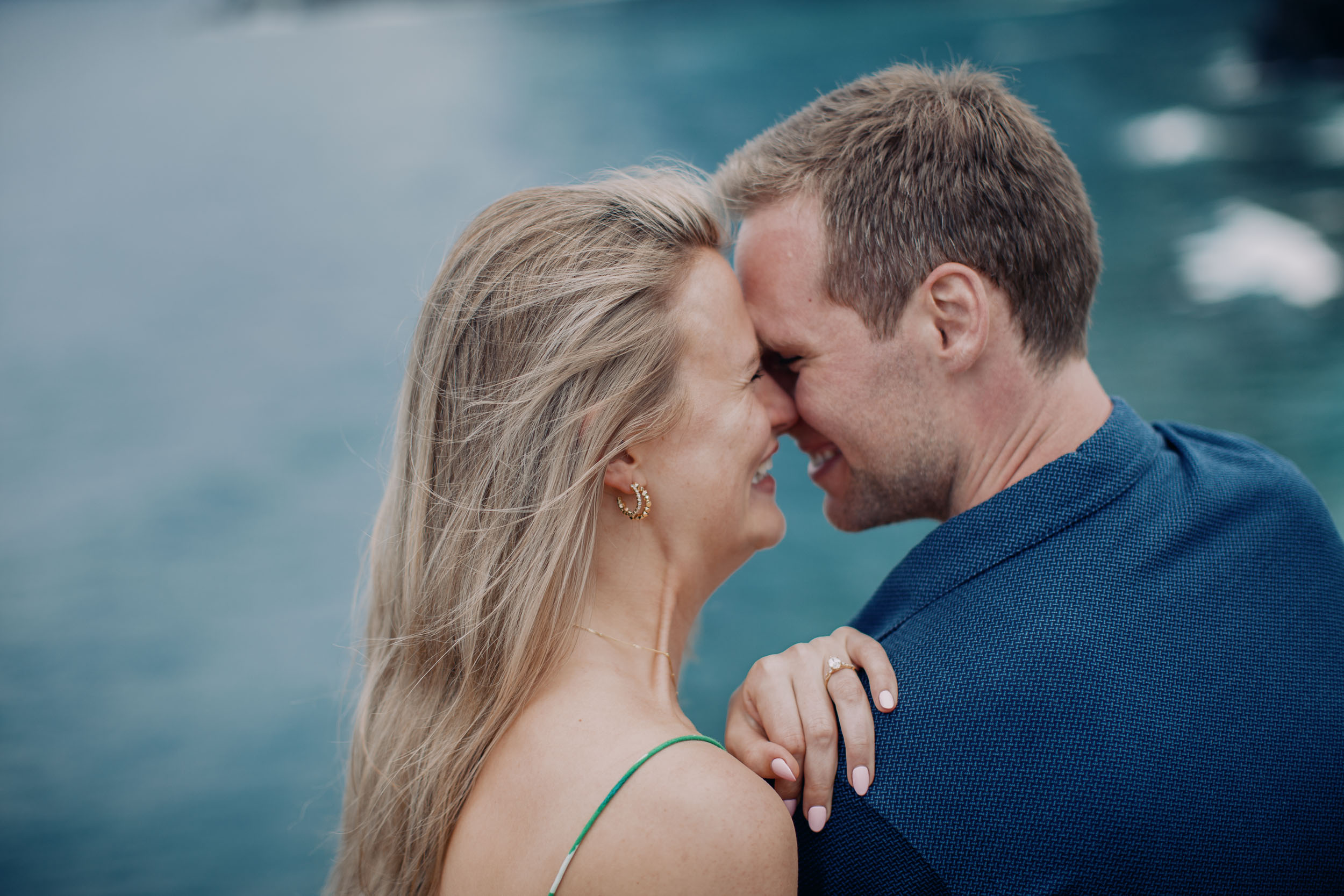 Couple laughing at clifftop after proposal, Funchal, Madeira