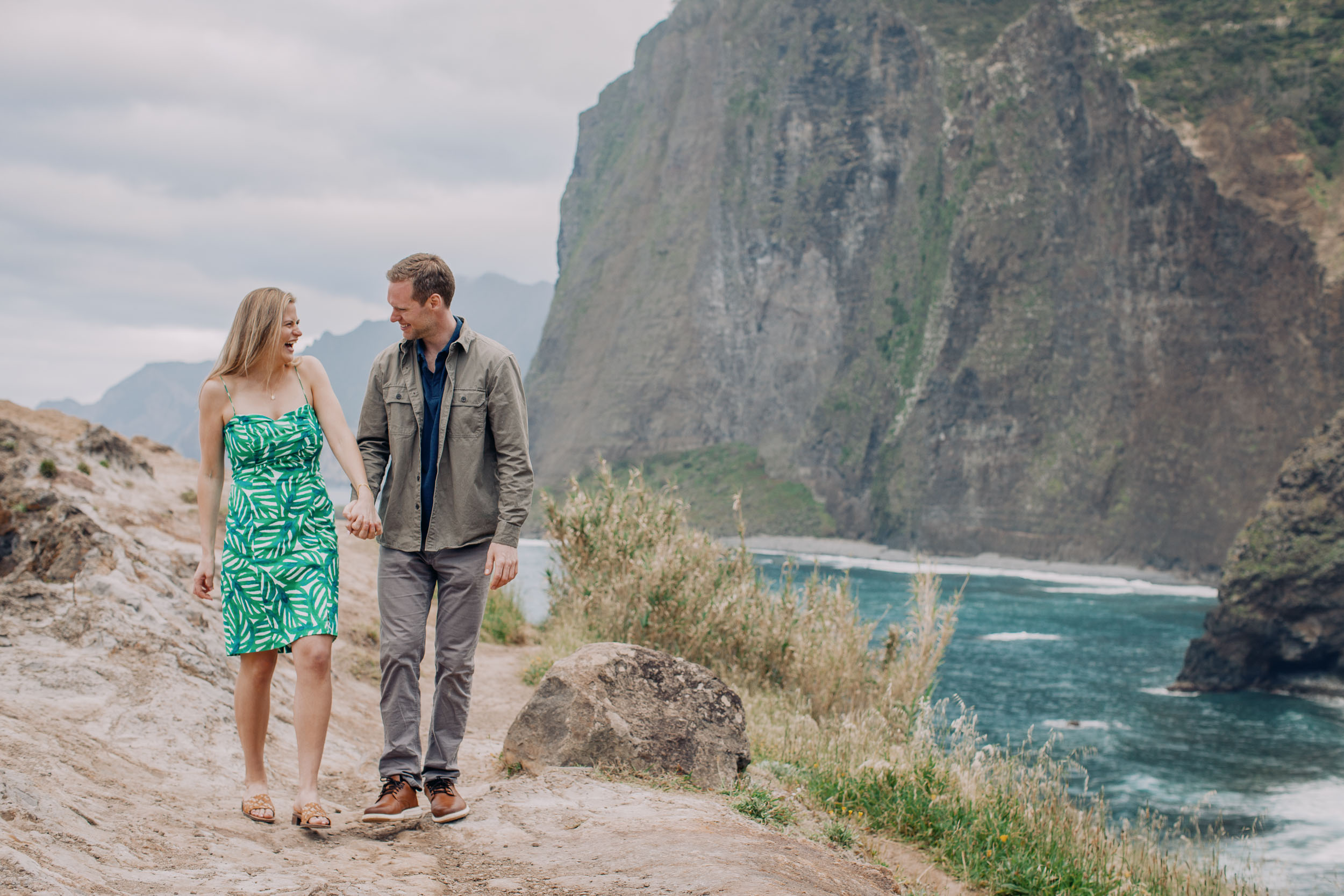 Couple laughing at clifftop after proposal, Funchal, Madeira