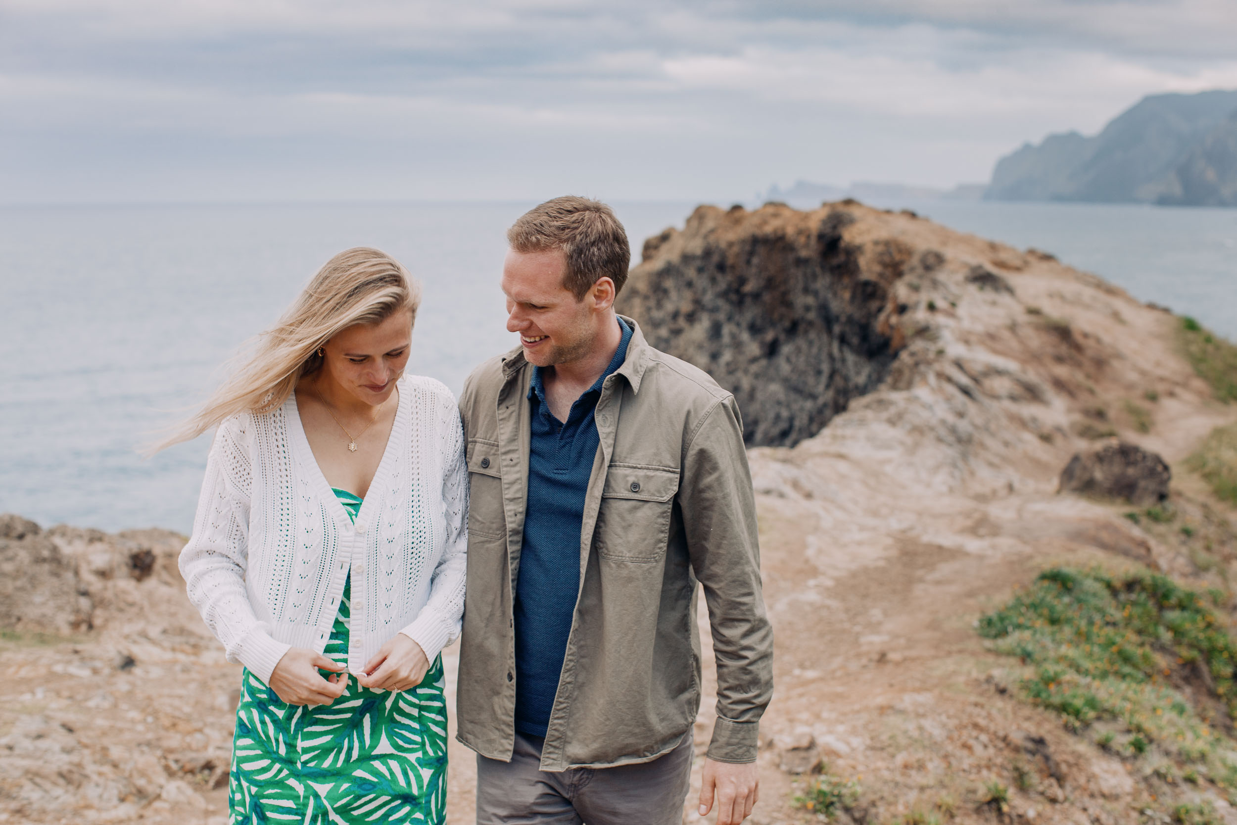 Couple walking along Atlantic clifftop at Miradouro do Guindaste, Madeira