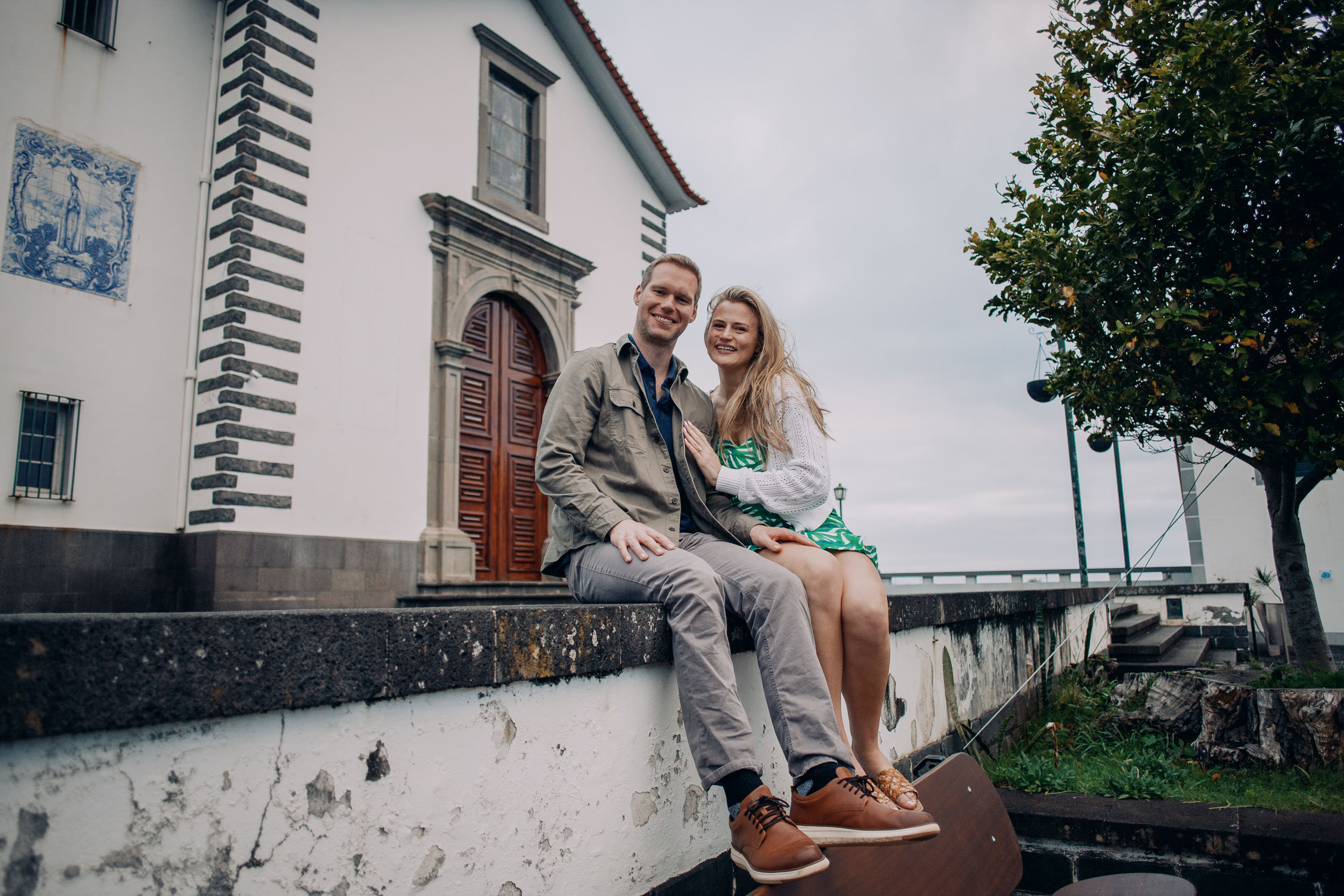 Couple embracing at rocky viewpoint, Funchal, Madeira